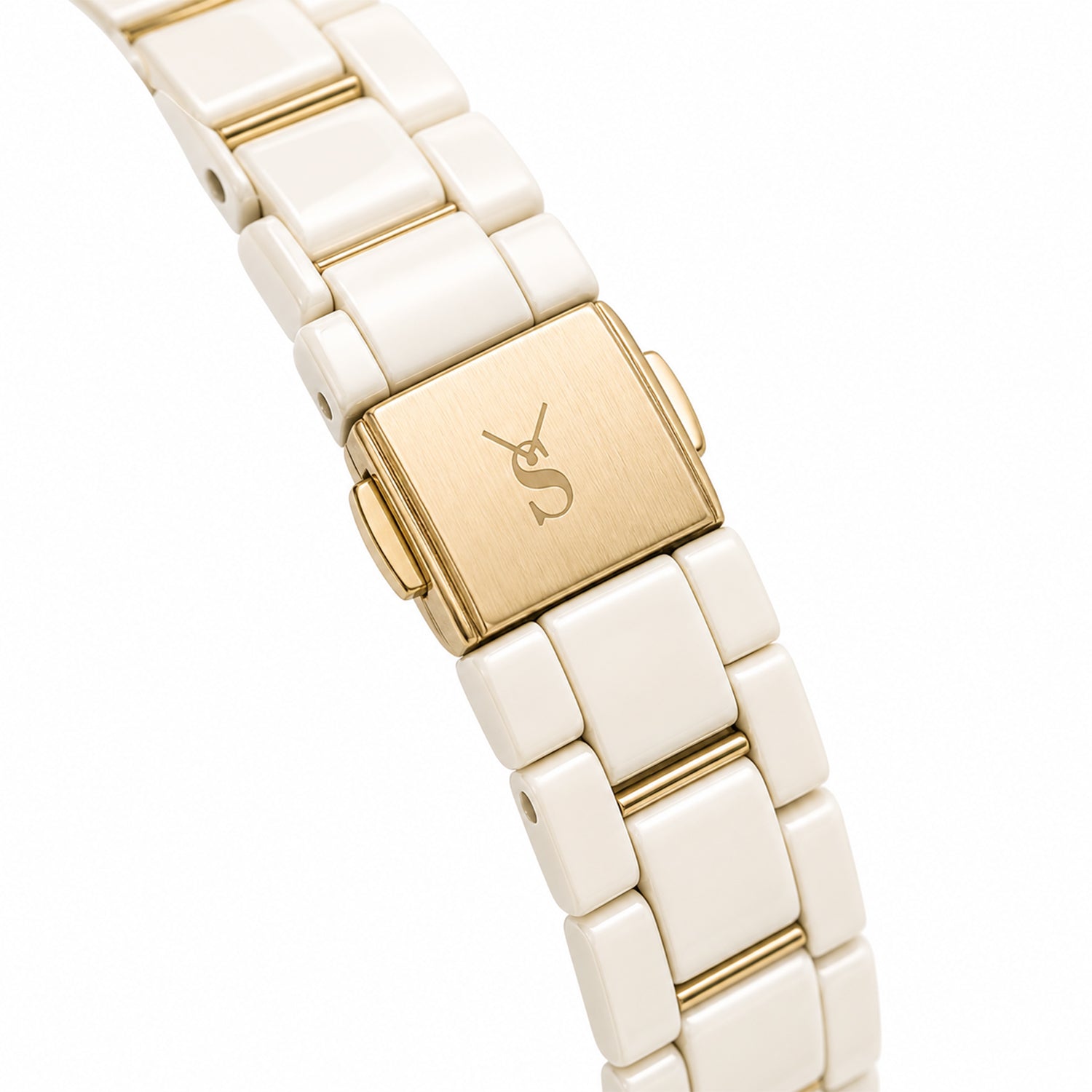 White ceramic watch with gold clasp on a white background