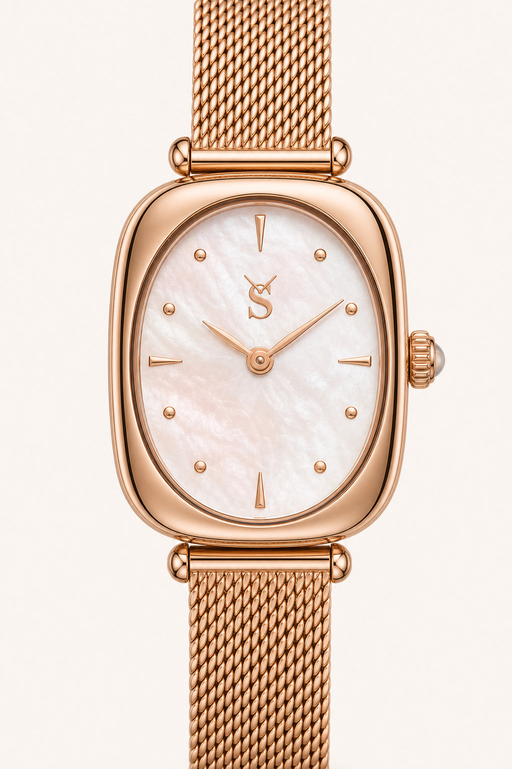 Rose gold watch with a mesh band on a white background