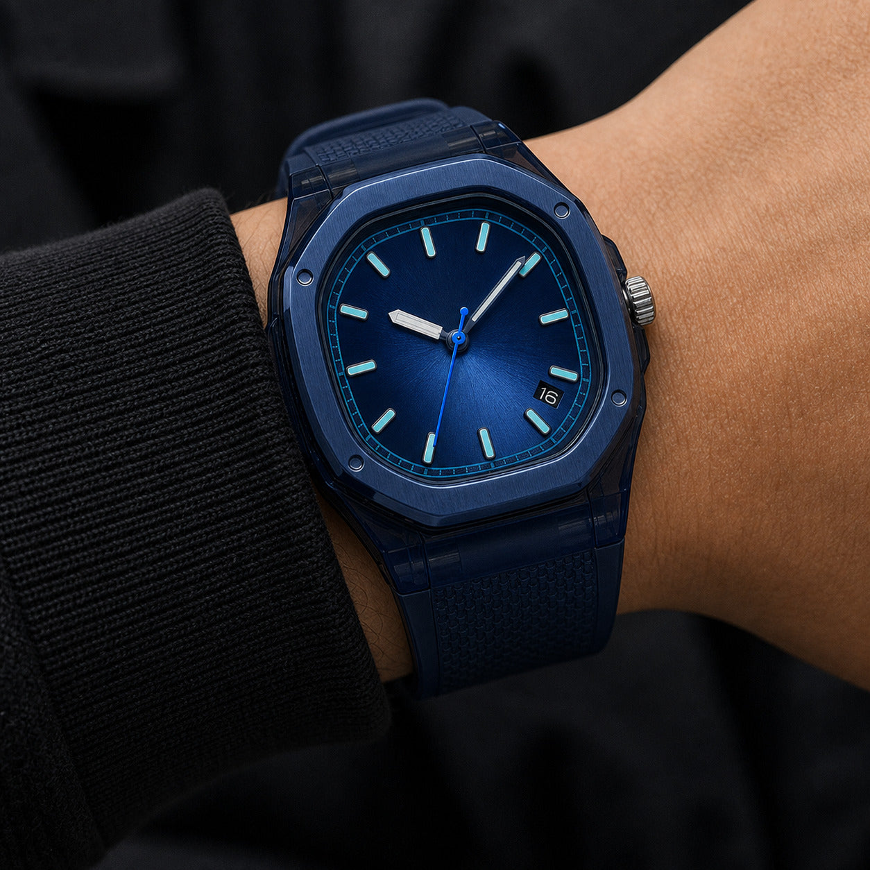 Blue watch on a wrist with a dark background