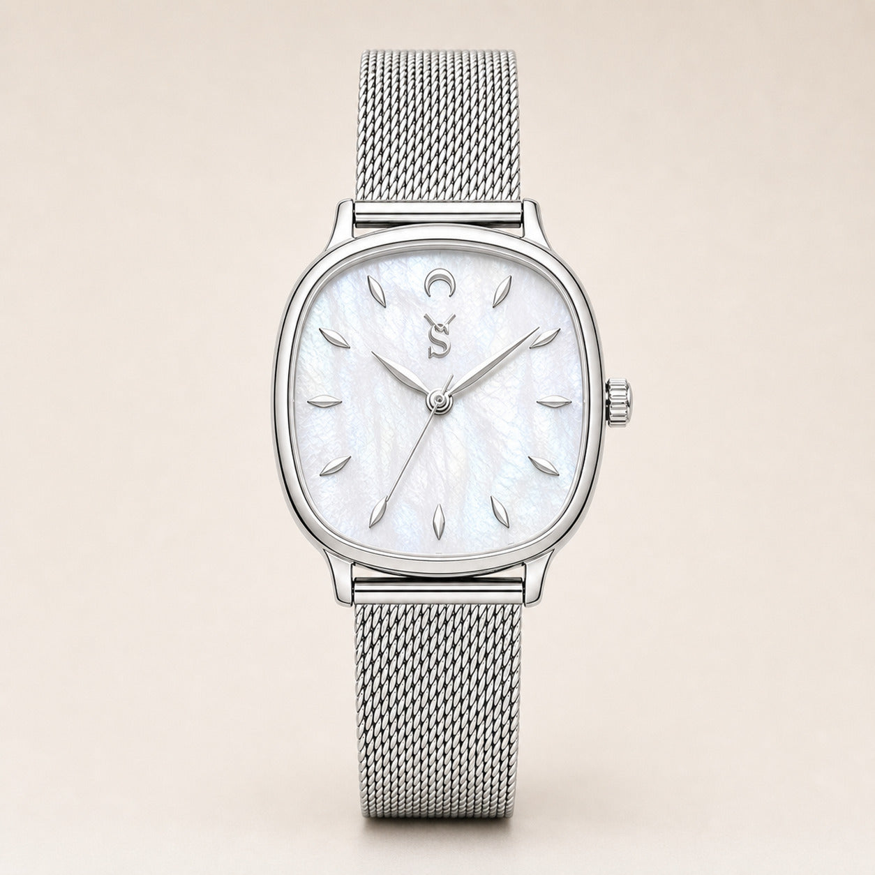 Silver watch with a mesh band on a beige background
