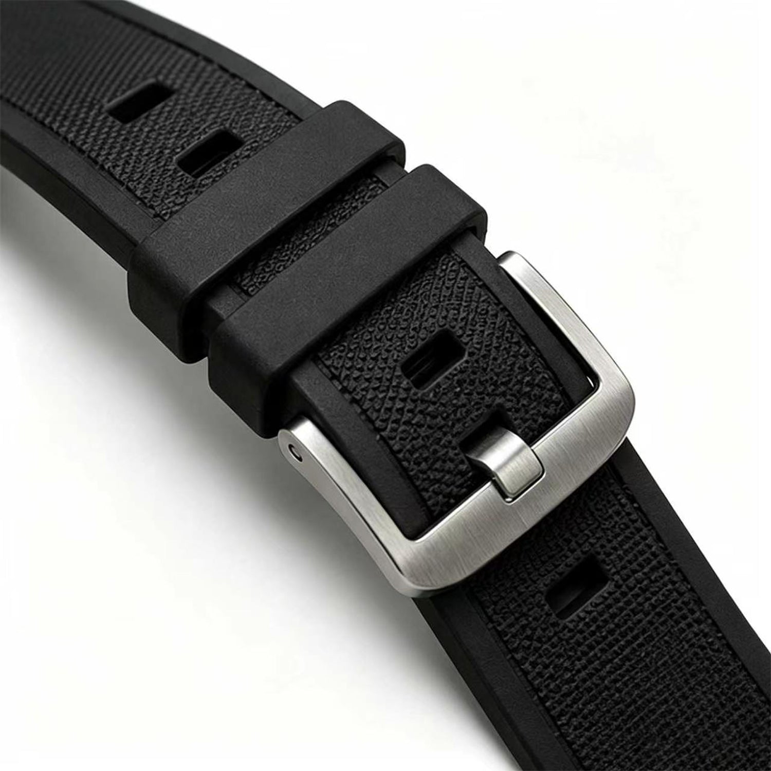 Black watch strap with silver buckle on a white background
